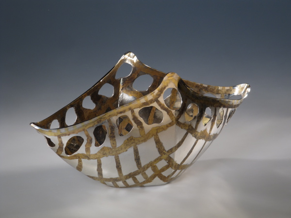 Piece -- materials: silver, brass patinated; dimensions: 28.5 x 12.5 x 14 h cm;