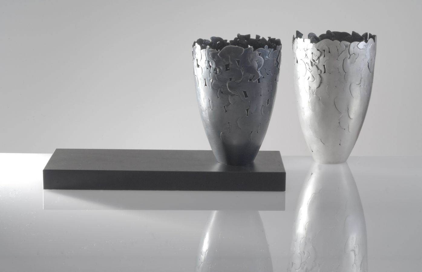 Piece -- materials: silver, patinated silver; dimensions: diameter 9, 13 and 15 h cm;